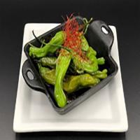 Blistered Shishito Peppers · Garlic aioli roasted shishito peppers, sometimes super spicy so be careful.