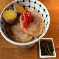 Chashu Mini Bowl · Pork chahu, ajrtama, pickled ginger, spinach, and sesame seeds on rice.