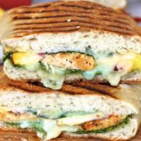 Chicken Avocado Panini · Grilled chicken marinated with olive oil with fresh sliced avocados and Swiss cheese topped ...
