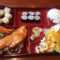 Salmon Teriyaki Combo Box · Served with California roll, five pieces of shumai (can substitute with tempura), green sala...