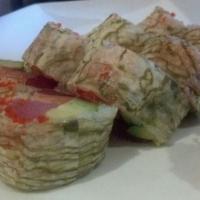 Tiger Roll · Tuna, salmon, yellowtail, tobiko, tempura flakes, avocado wrapped in isonoyuki.