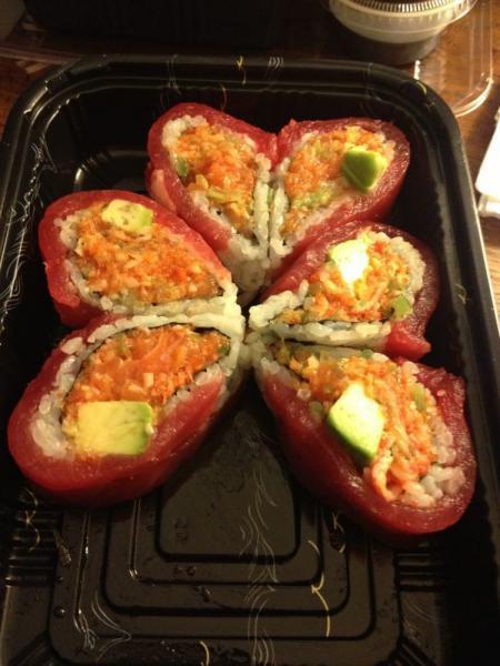 Passion Roll · Heart shape. Spicy tuna, salmon, white fish, seaweed salad and avocado inside, tuna outside.