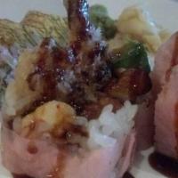 Thunder Roll · Shrimp tempura, avocado, lobster salad, eel, rolled with soybean nori.