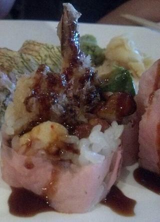 Thunder Roll · Shrimp tempura, avocado, lobster salad, eel, rolled with soybean nori.