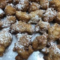 3 Festival zepploes · 3 Sweet dough fried with powdered sugar sprinkled on top