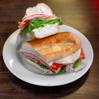 S9. Italian Hero Sandwich · Ham cappi, Genoa salami, pepperoni, provolone, lettuce, tomato, onion, and oil and vinegar o...