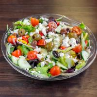 Greek Salad · Crisp romaine lettuce with feta cheese, peppers, cucumber, tomato, red onion and Kalamata ol...