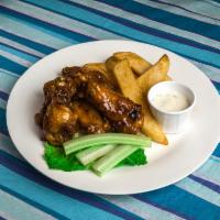 Chicken Wings · BBQ, Buffalo, Asian BBQ or naked, served with fries.