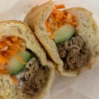 Beef Sandwich · Mayonnaise, butter, cucumber, julienne carrots, daikon radish, and cilantro. Served on a toa...