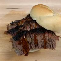 Sliced Brisket Sandwich with 1 Side · After 12-14 hours of being smoked, nothing is better than a fresh-sliced Certified Angus bee...