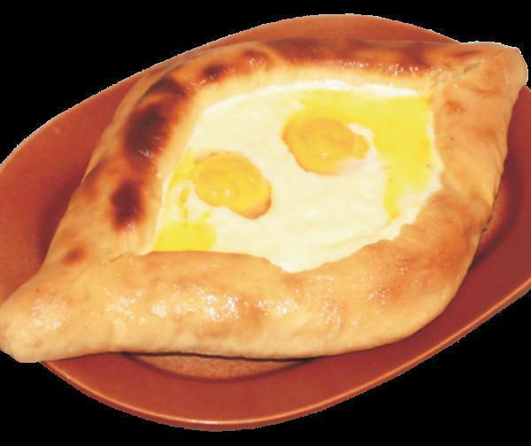 Khachapuri · A traditional Georgian dish of cheese filled bread. Bake with mozzarella and sprinkled with feta cheese, topped with 2 sunny side up eggs.