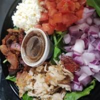 Out to Dry Salad · Roasted chicken, Applewood smoked bacon, sun dried tomatoes, feta cheese, sweet red onions a...