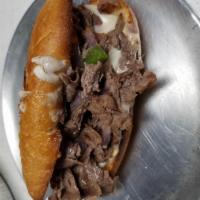 Philly cheesesteak · Delicious philly meat with onions,  mushrooms and bell peppers,  cheese whiz and provolone c...