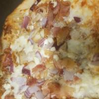 BBQ or Bust Pizza · Tangy bar-b-que sauce, mozzarella cheese, grilled onions and roasted chicken breast.