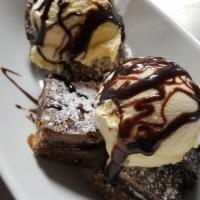 Nasty Girl · Our dirty girl brownie topped with vanilla ice cream and a caramel drizzle