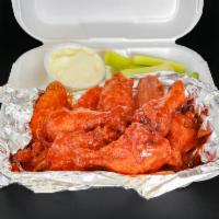 Buffalo Wings · Served with blue cheese and celery.
