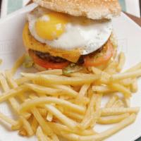 B2. Texas Burger Deluxe · Beef patty, fried egg, Swiss cheese, lettuce, pickles & 1000 Island dressing.