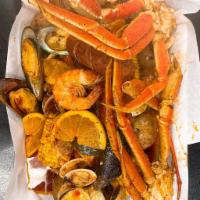 Combo 3 · 1 lb of Snow Crab, Shrimp, Mussels, Clams, 3 Corns, 6 Potatoes, 4 Sausage	