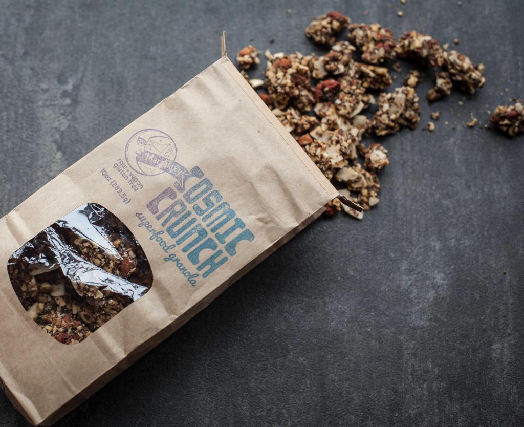 Cosmic Crunch Granola · Superfood nut-base, filler-free, dehydrated, raw homemade granola is made of walnuts, almonds, chia, flax, maca, goji berries, coconut oil, vanilla, and maple syrup.