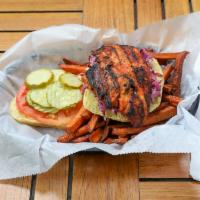 Grilled Chicken Sandwich · Smoky grilled chicken, topped with spicy coleslaw, tomato and pickles on a Martin's potato r...