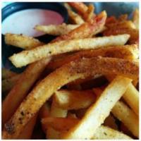 Basket of Cajun Ranch Fries · Cajun spiced fries with a side of buttermilk ranch to dip