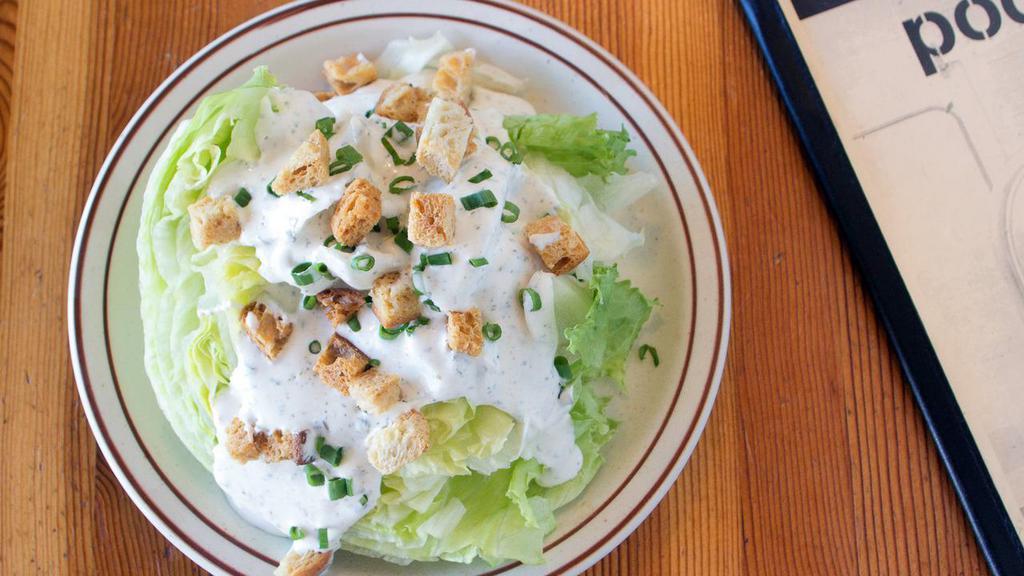 Iceburg Wedge · Housemade croutons, green onion, your choice of Podnah’s blue cheese, Thousand Island, ranch or vinaigrette. Add bacon for an additional charge.
