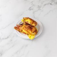 Breakfast on a Croissant · two eggs freshly cooked,  your favorite meat added on it  with a delicious melted cheese on ...