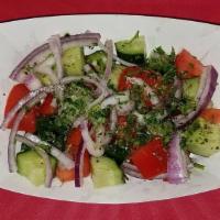 Shirazi Salad · Chopped cucumbers, tomatoes, onions, and dry mint with olive oil and freshly squeezed lemon ...