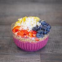 Pitaya Bowl · Topped with granola, strawberries, pineapple, kiwi, coconut, and honey.