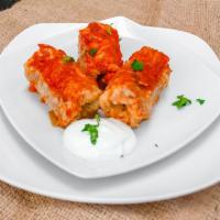 Cabbage Rolls 3pc · Seasoned Beef, Chicken and Rice filling rolled in a cabbage leaf toped with homemade tomato ...