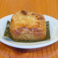 Cassava Cake · Grated cassava with coconut milk, coconut cream, and a toasted layer of condensed milk toppi...