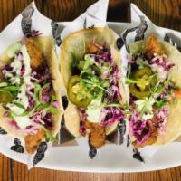 Mermaid Fish Tacos · Beer batter, red cabbage, pickled jalapeño, cilantro crema and pico de gallo.