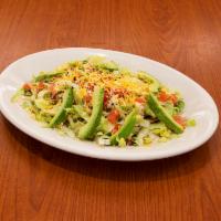 Avocado Salad · A crispy corn tortilla over a fresh cut lettuce, shredded chicken, and rancho beans garnishe...