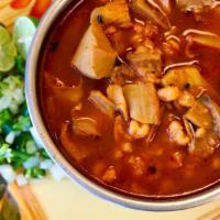 POZOLE  (Hominy Stew with pork) · A traditional hot soup with bone in tender pork meat with hominy.