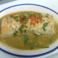 Wet Chile Verde Burrito · A flour tortilla filled with chunks of tender pork, rice, rancho beans guacamole and sour cr...