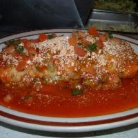 Wet Burrito · A flour tortilla filled with your choice of meat, rice, rancho beans, guacamole and sour cre...