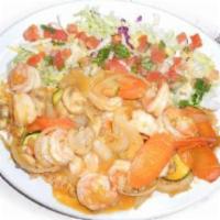 Arroz con Camarones · Prawns sauteed on special secret sauce with carrots, onions, zucchini, mushrooms. Served ove...