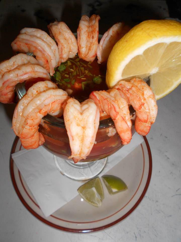 Cocktail de Camarones · An 18 oz. glass filled with prawns cooked in their own juice mixed with diced tomatoes, onions, cilantro, avocado, orange juice and ketchup. Served hot or cold. No rice or beans.