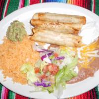 Flautas · 3 crispy corn tortillas filled with fresh tasty chicken or shredded beef. Garnished with pic...