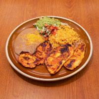 Pollo Adobado · A marinated boneless skinless chicken breast roasted on authentic Mexican spices.