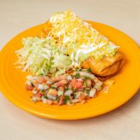 4. Chimichanga · Your choice of shredded chicken or ground beef or shredded beef cooked with veggies. Beans a...