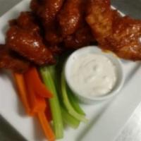 Wings · Crispy wings with choice of sauce. All served with  Blue cheese