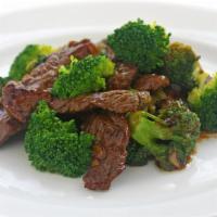 81. Beef with Broccoli · Served with rice.