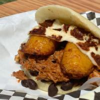 Pabellon Arepa · Shredded beef, black beans, white cheese at the grill and plantain.