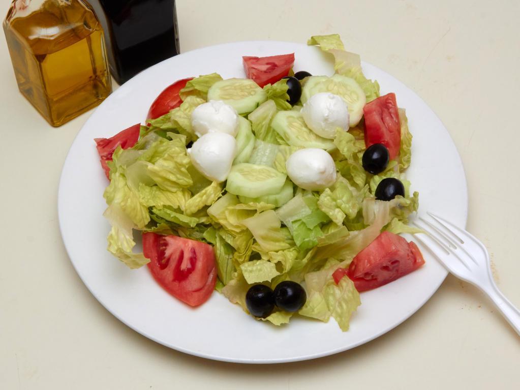 House Salad · Romaine lettuce, tomato, cucumbers, black olives and fresh mozzarella. Served with bread.