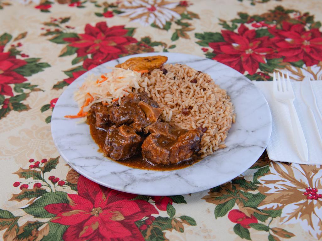 Oxtail · Oxtails cook with delicious brown stew sauce, tender, tasty and flavored to your taste,Served with rice, steam vegetable or coleslaw and plantain.