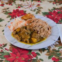 Curry Goat · Served with rice,  steam vegetable or coleslaw, and plantain.