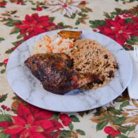 Jerk Chicken meal · Served with rice, steam vegetable or coleslaw, and plantain.