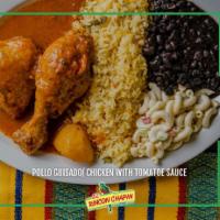 Pollo Guisado · 2 pieces of chicken in tomato sauce, onion and chili peppers (not spicy) rice, black beans, ...