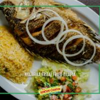Mojarra Frita · A whole fried and seasoned tilapia accompanied by rice or French fries, pico and guacamole.